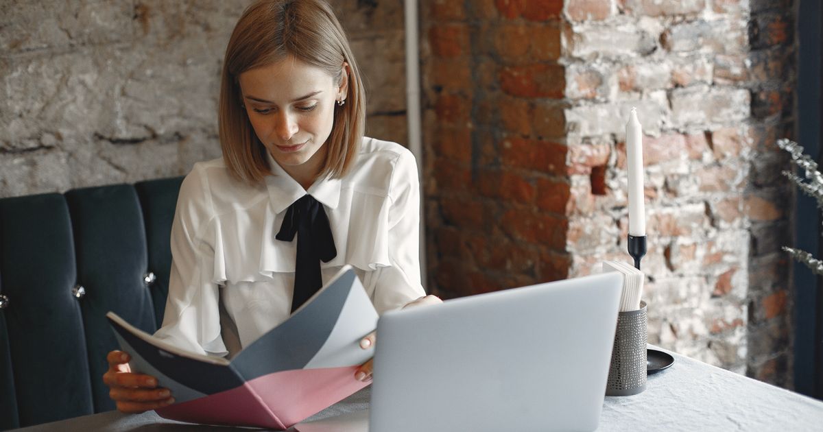 Travel nurse in Michigan hospital reviewing assignment documentation